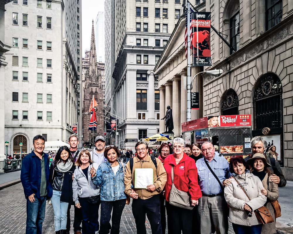 Financial crisis tour group stops to pose for a photo.