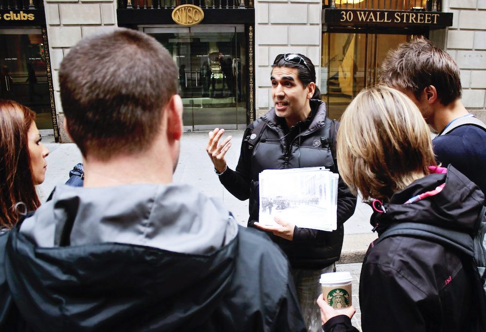 Tour guide talking with Wall Street Experience tour group