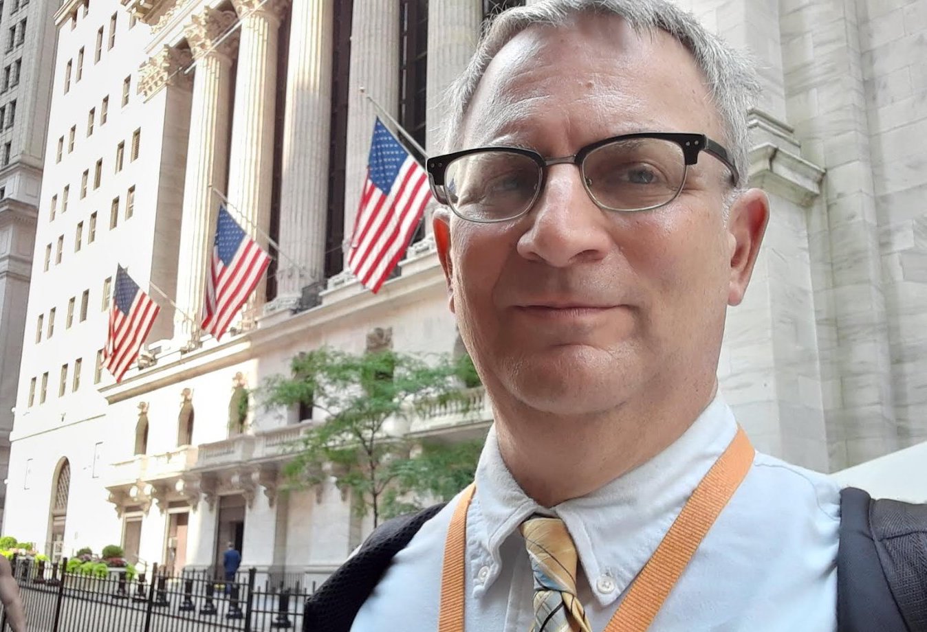 James Foytlin, Wall Street tour guide, in front of the buttonwood tree at the NYSE